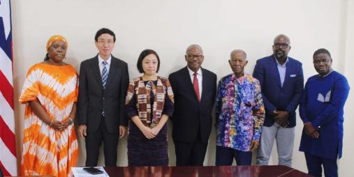 Public Works Minister Hon. Roland L. Giddings (second from right) with some Senior Government Officials and JICA Representatives at the signing ceremony for the construction of a 1.7km road corridor.