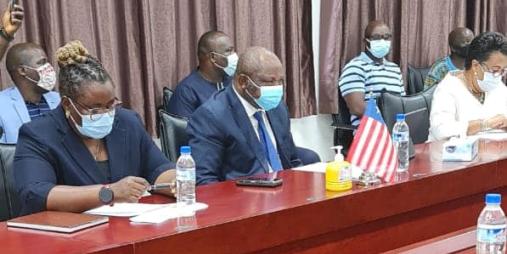 Acting Minister Ruth C. Collins (left) at the signing ceremony.